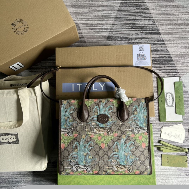 G*u*i shopping bags